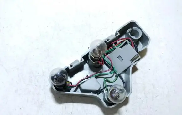 Mazda 121 Tail light bulb cover holder