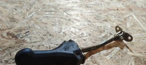 Front door check strap stopper