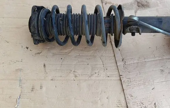 Volkswagen Caddy Front shock absorber with coil spring