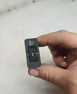 Headlight level height control switch