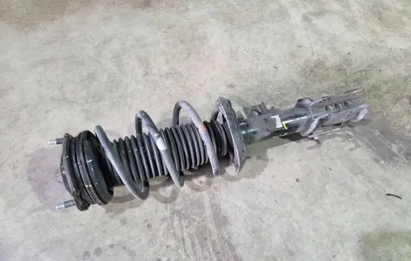 Front shock absorber with coil spring