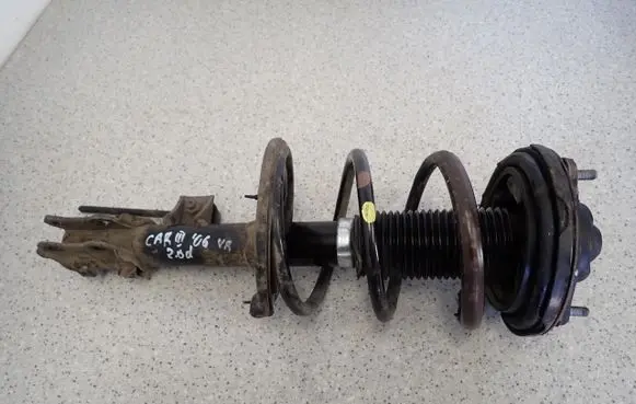 KIA Carens III Front shock absorber with coil spring 