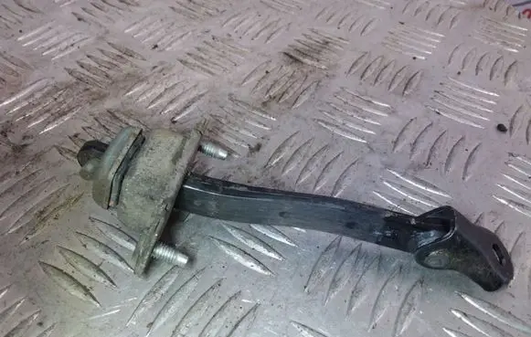 Subaru Legacy Rear door check strap stopper