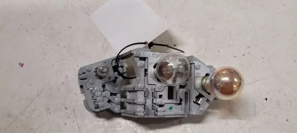 Tail light bulb cover holder