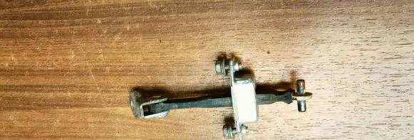 Subaru Justy Front door check strap stopper
