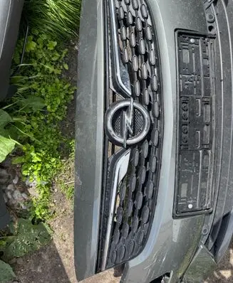 Opel Astra K Front bumper upper radiator grill 39130501 236528