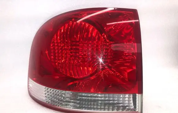 Volkswagen Touareg I Tail light bulb cover holder 7L6945257 7L6945095K