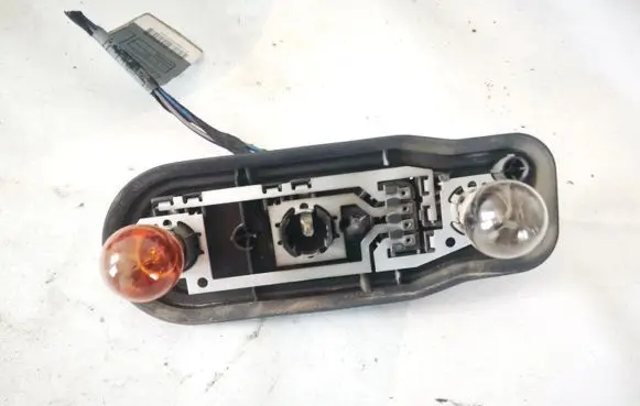 Tail light bulb cover holder