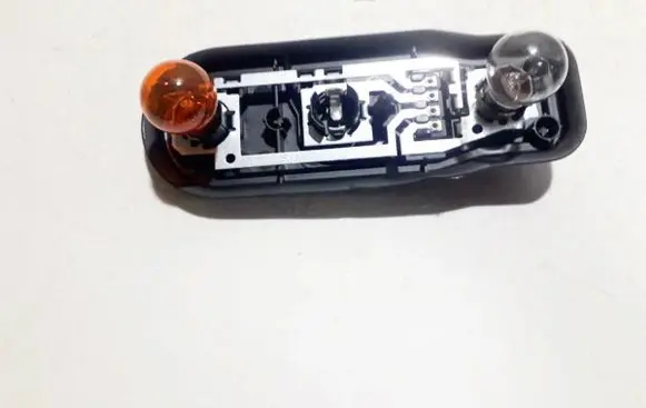 Tail light bulb cover holder