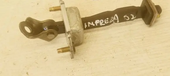 Front door check strap stopper