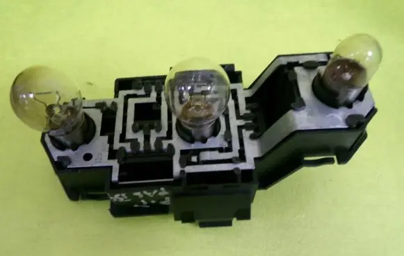 Tail light bulb cover holder