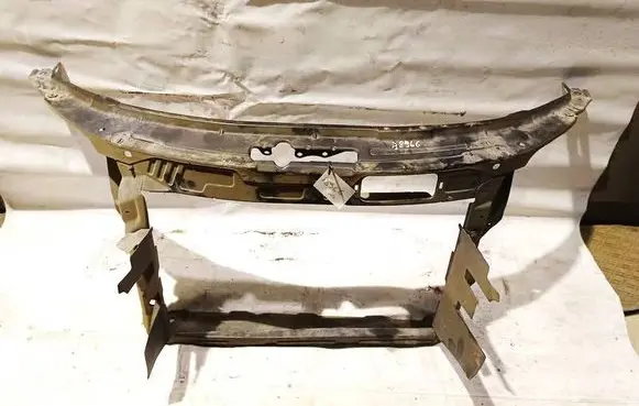 Radiator support slam panel