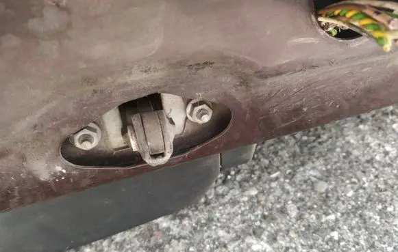 Front door check strap stopper