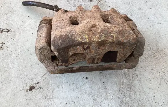 Subaru Forester SF Front brake caliper