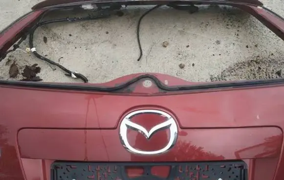 Mazda CX-7 Trunk door license plate light bar 