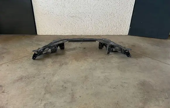 Top upper radiator support slam panel