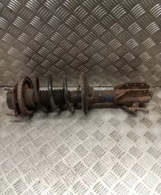 Mazda 323 F Front shock absorber with coil spring