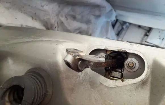 Front door check strap stopper