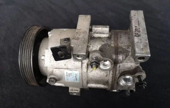 KIA Sportage Air conditioning (A/C) compressor (pump) 97701D7100