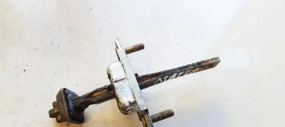 Mazda 121 Front door check strap stopper 