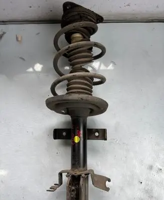Front shock absorber with coil spring