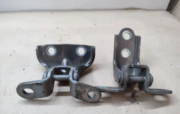 Rear door upper hinge