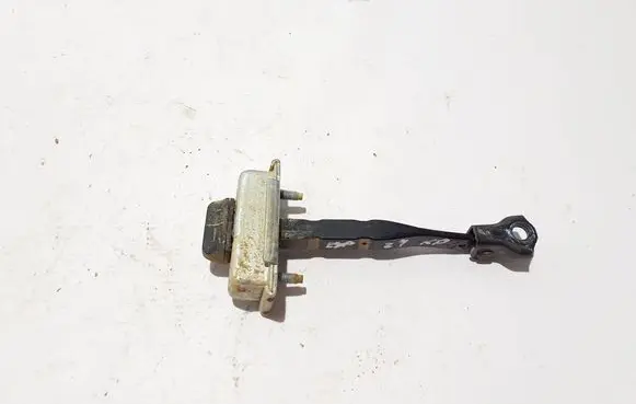 Front door check strap stopper