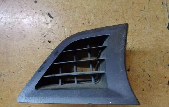 Subaru Legacy Dash center air vent grill 66115AJ000