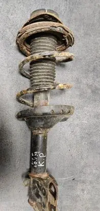 Subaru Outback Front shock absorber with coil spring