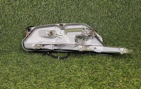 Tail light bulb cover holder