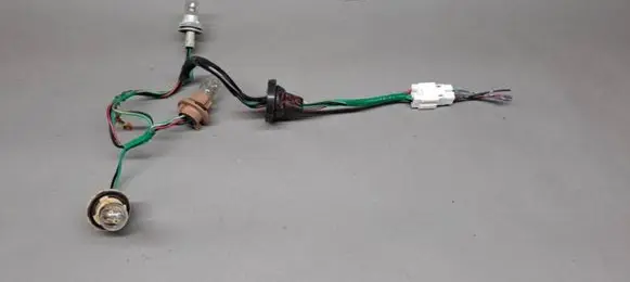 Nissan Juke I F15 Tail light bulb cover holder