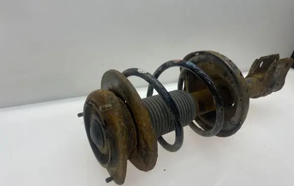 Subaru Legacy Front shock absorber with coil spring