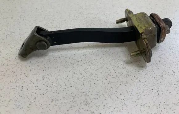 Subaru Legacy Rear door check strap stopper