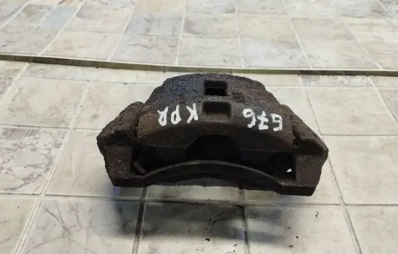 Mazda 323 F Front brake caliper