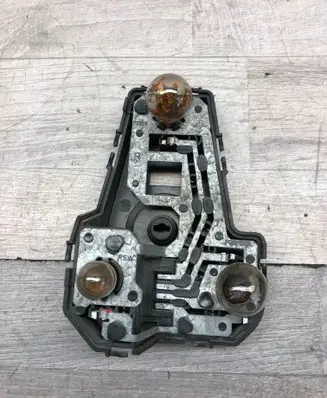 Tail light bulb cover holder