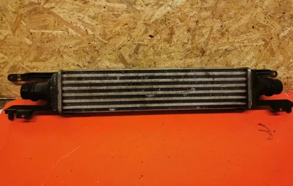 Opel Corsa D Intercooler radiator 55702004