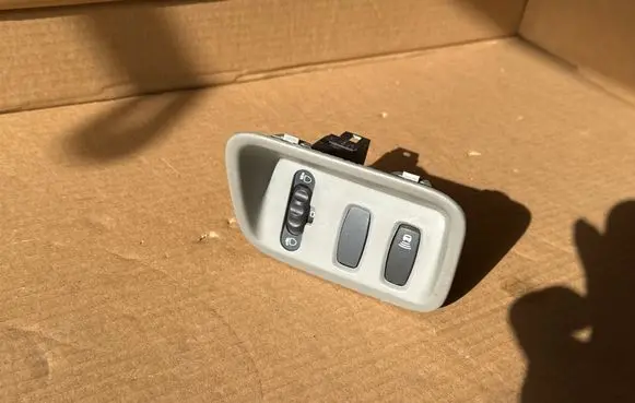 Headlight level height control switch