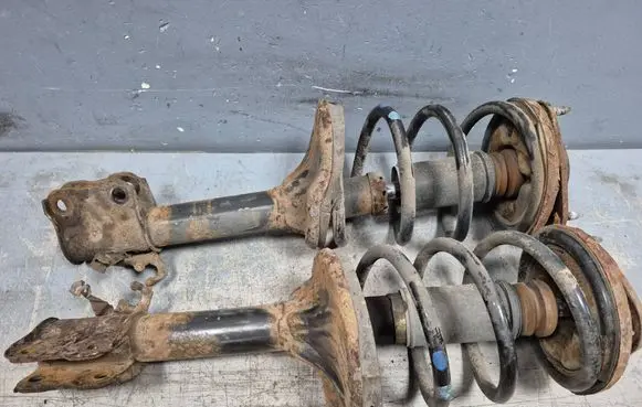 Mitsubishi Outlander Front shock absorber with coil spring