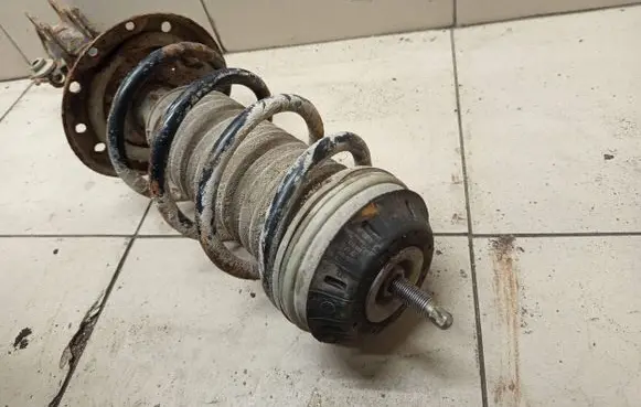 Opel Corsa D Front shock absorber with coil spring