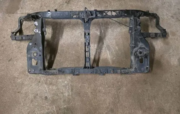 Radiator support slam panel