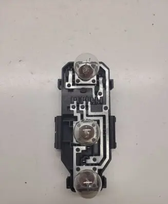 Tail light bulb cover holder