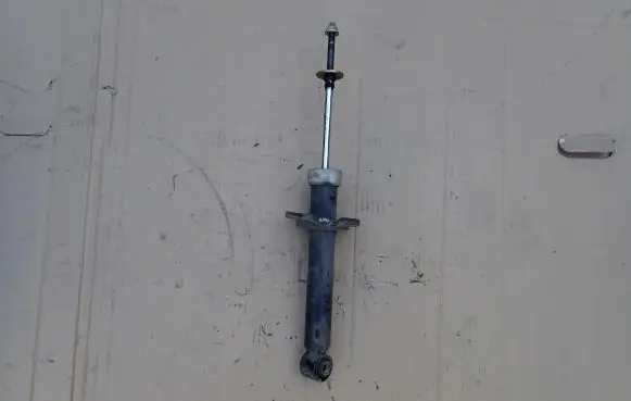 Nissan Almera Tino Front shock absorber with coil spring