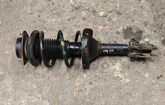 Subaru Outback Front shock absorber with coil spring 20310AJ090