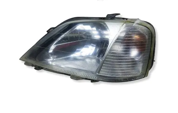 Dacia Logan I Headlight/headlamp 89029771KASACJA 89029771