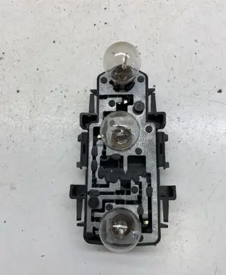 Tail light bulb cover holder