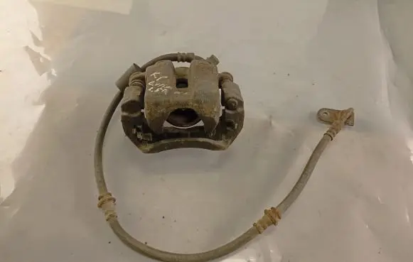 Suzuki Grand Vitara I Front brake caliper K3817X