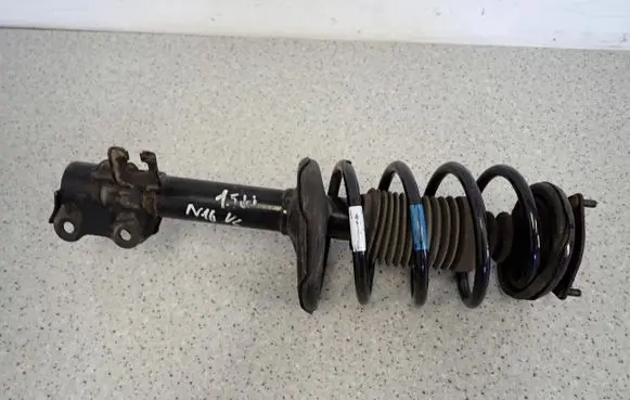 Nissan Almera N16 Front shock absorber with coil spring
