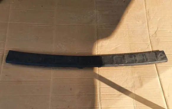 Rear bumper trim bar molding