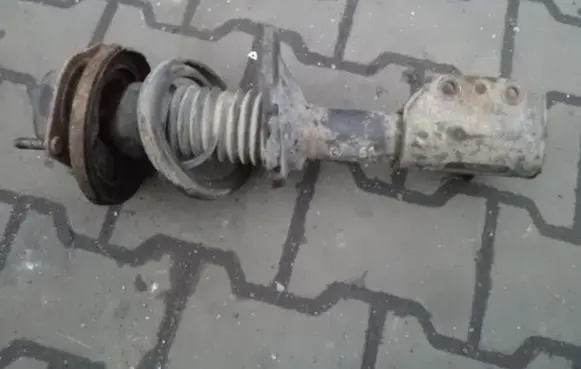 Mazda 323 Front shock absorber with coil spring