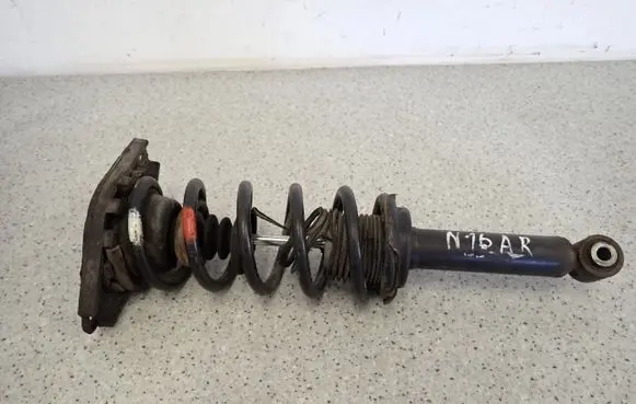 Nissan Almera N16 Front shock absorber with coil spring